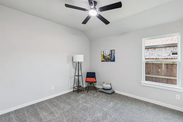 a bathroom with a granite countertop sink a toilet a mirror and shower