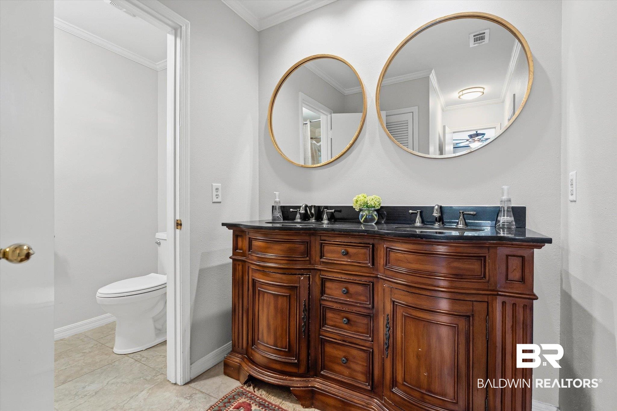 313 Brawood Drive Mobile, AL 36608 - Photo 16 of 32 Bathroom featuring crown molding, double vanity, and light tile patterned floors