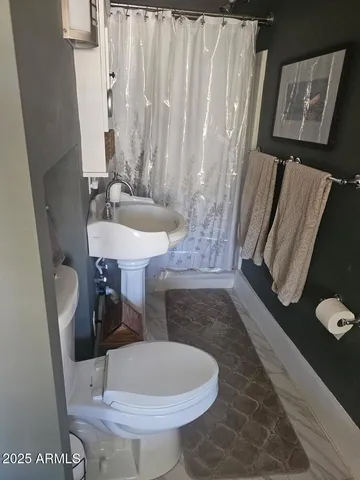 a dining room with furniture window and wooden floor