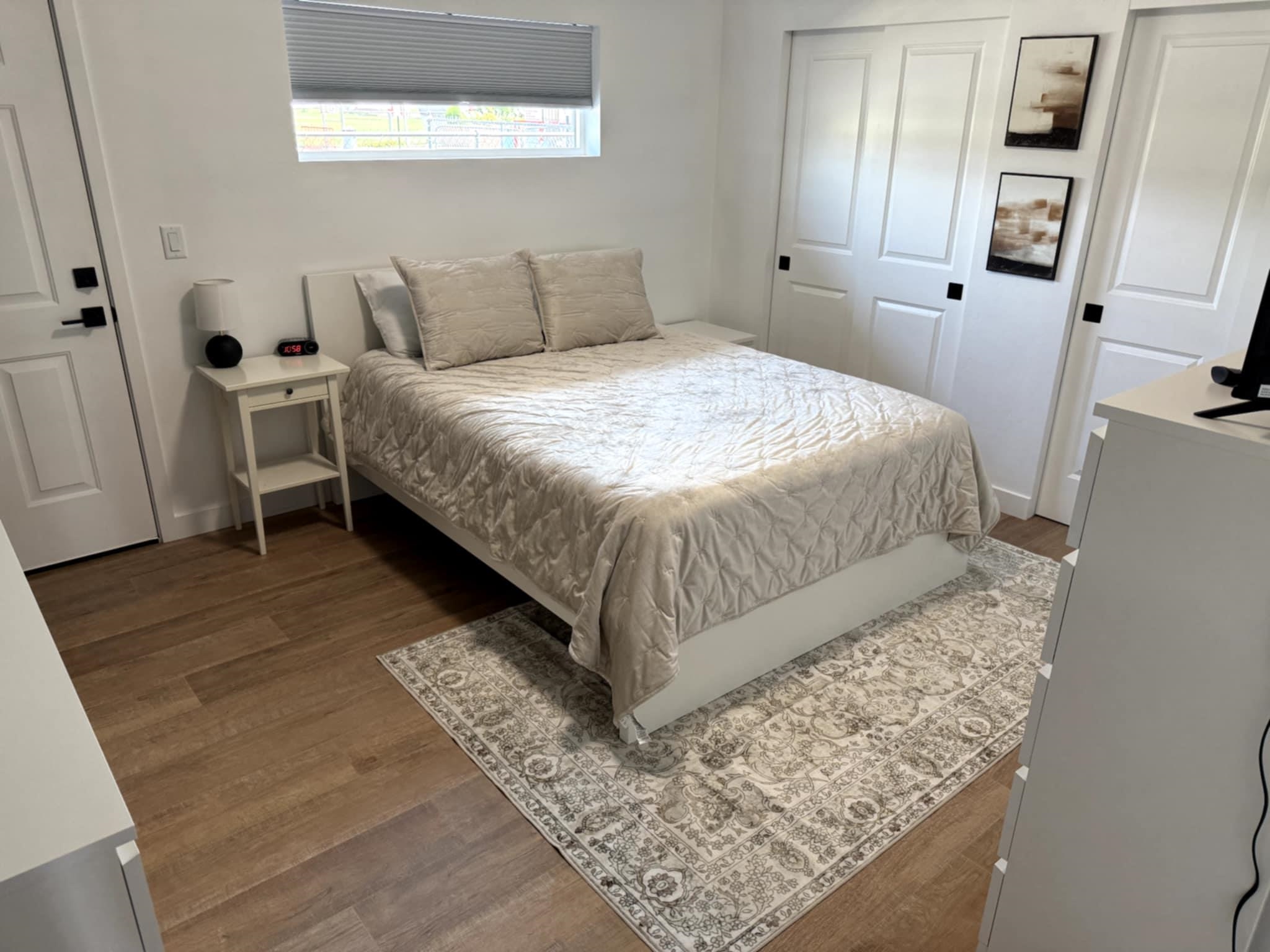 516 28 3/4 Road Grand Junction, CO 81501 - Photo 13 of 24 a bedroom with a bed and wooden floor
