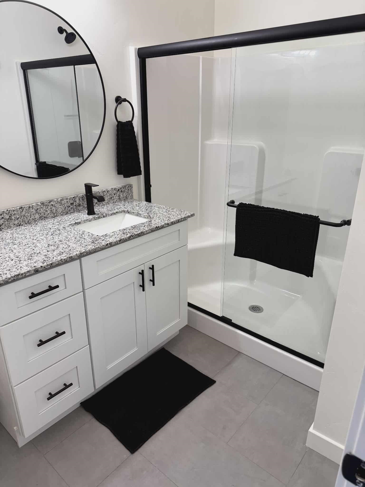 516 28 3/4 Road Grand Junction, CO 81501 - Photo 24 of 24 a bathroom with a double vanity sink and mirror