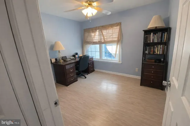 a workspace with furniture and window