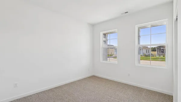 an empty room with windows