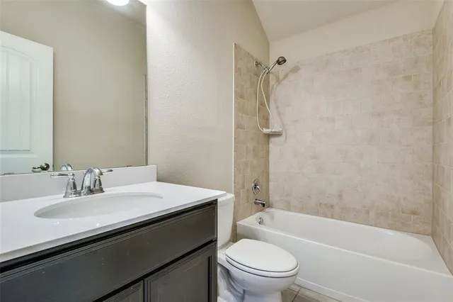 a bathroom with a sink a toilet and a bathtub