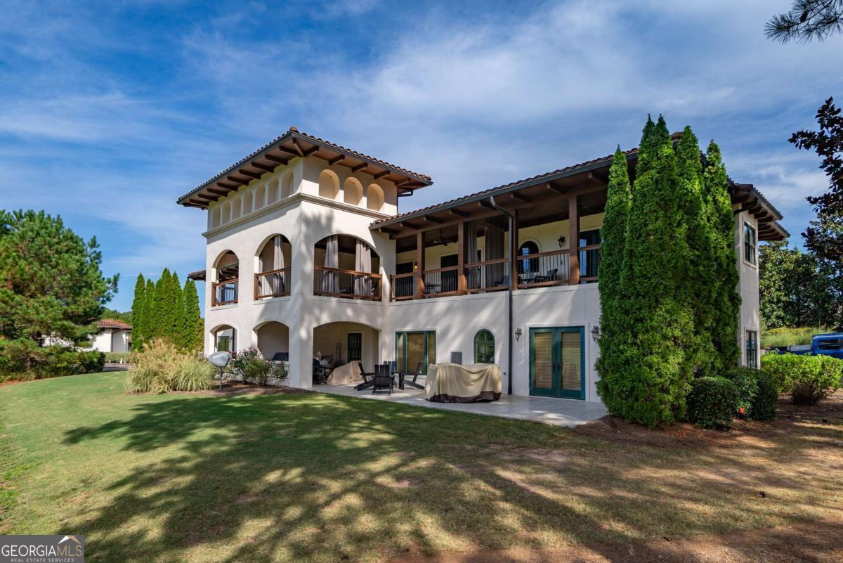 401 Cuscowilla Drive, Unit D Eatonton, GA 31024 - Photo 1 of 20 a front view of a house with a garden