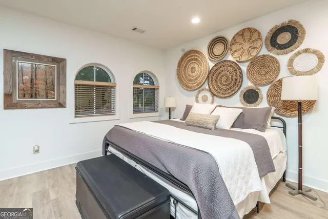 a bedroom with bed and a window