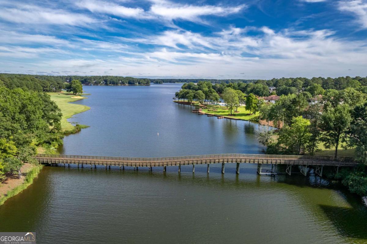 401 Cuscowilla Drive, Unit D Eatonton, GA 31024 - Photo 6 of 20 a view of a lake with outdoor space