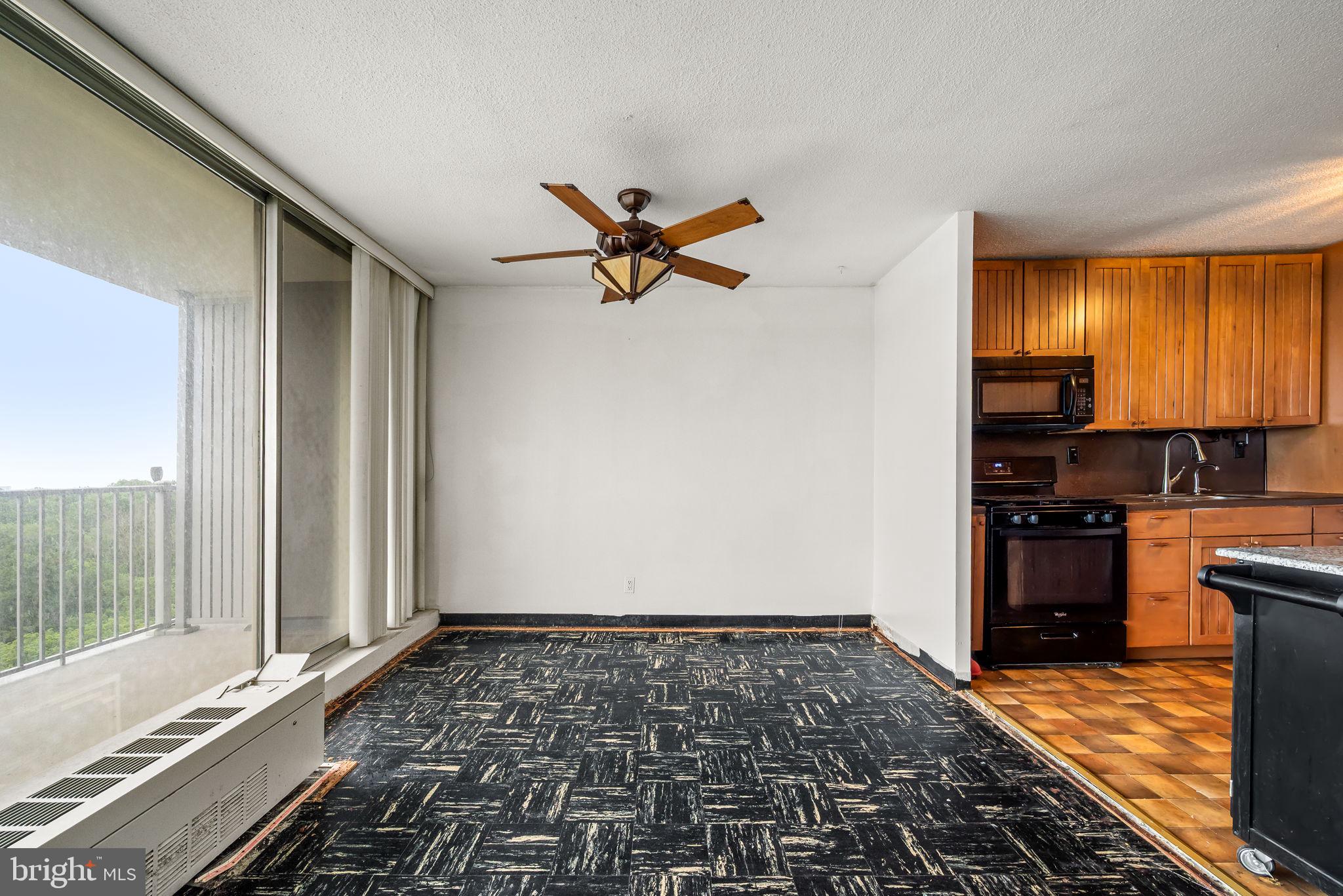 3900 West Ford Road, Unit 11B Philadelphia, PA 19131 - Photo 13 of 24 a very nice looking room with a rug