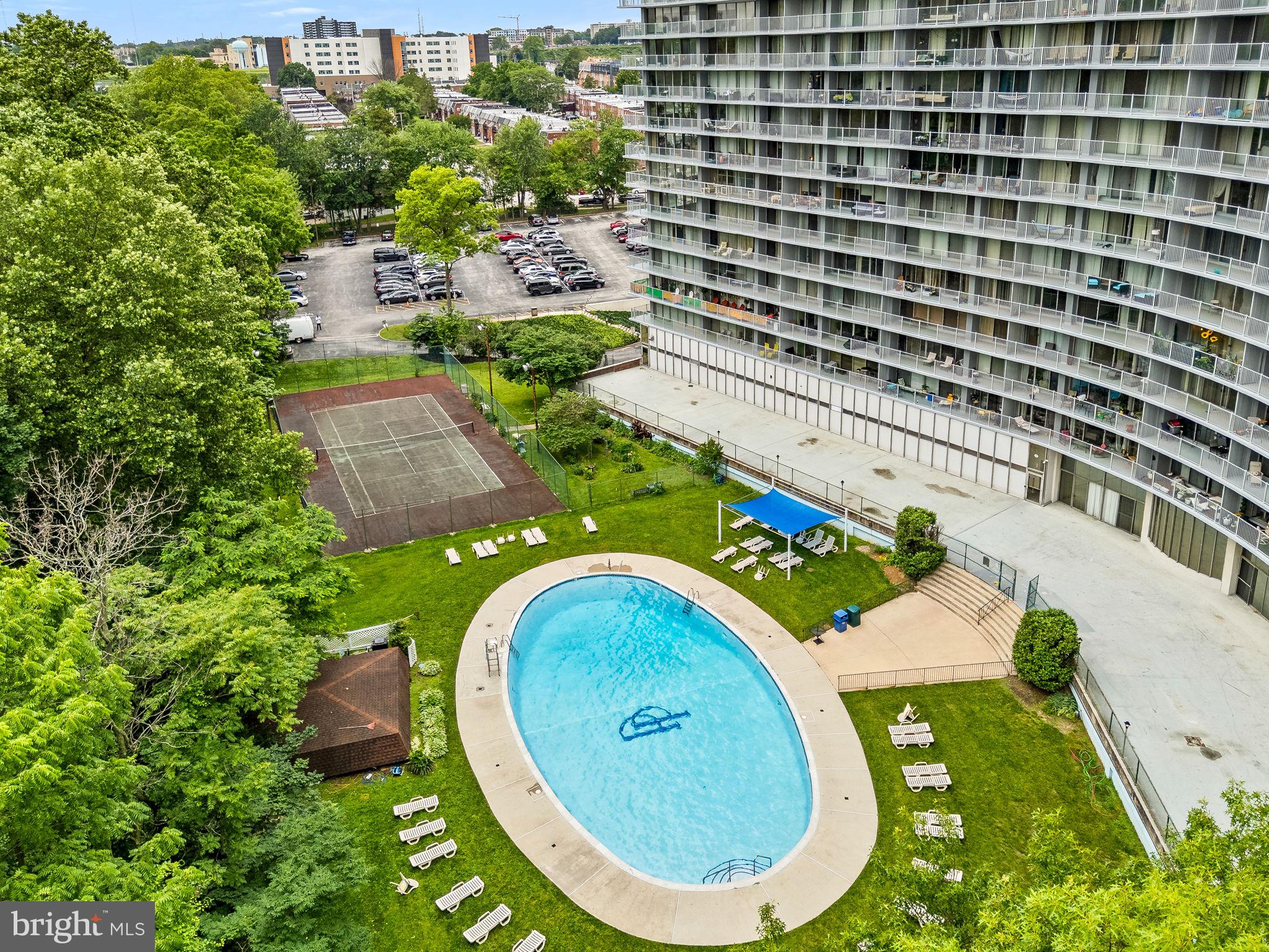 3900 West Ford Road, Unit 11B Philadelphia, PA 19131 - Photo 23 of 24 an aerial view of a swimming pool with a yard and plants
