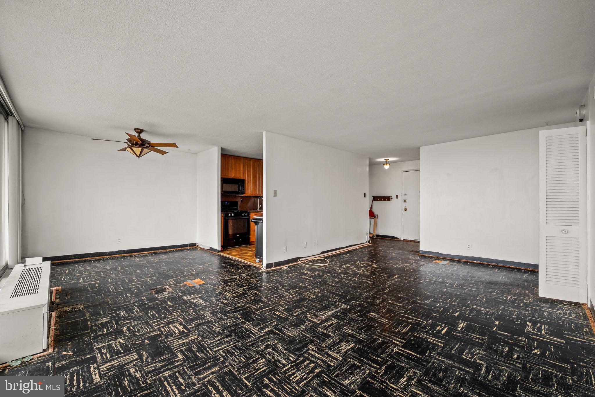 3900 West Ford Road, Unit 11B Philadelphia, PA 19131 - Photo 8 of 24 wooden floor in a hall with an empty room