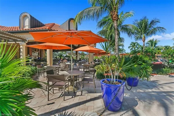 a view of a patio with couches under an umbrella