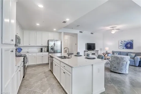 a kitchen with counter top space appliances and cabinets