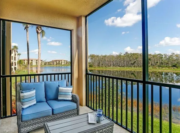 a view of a balcony with furniture