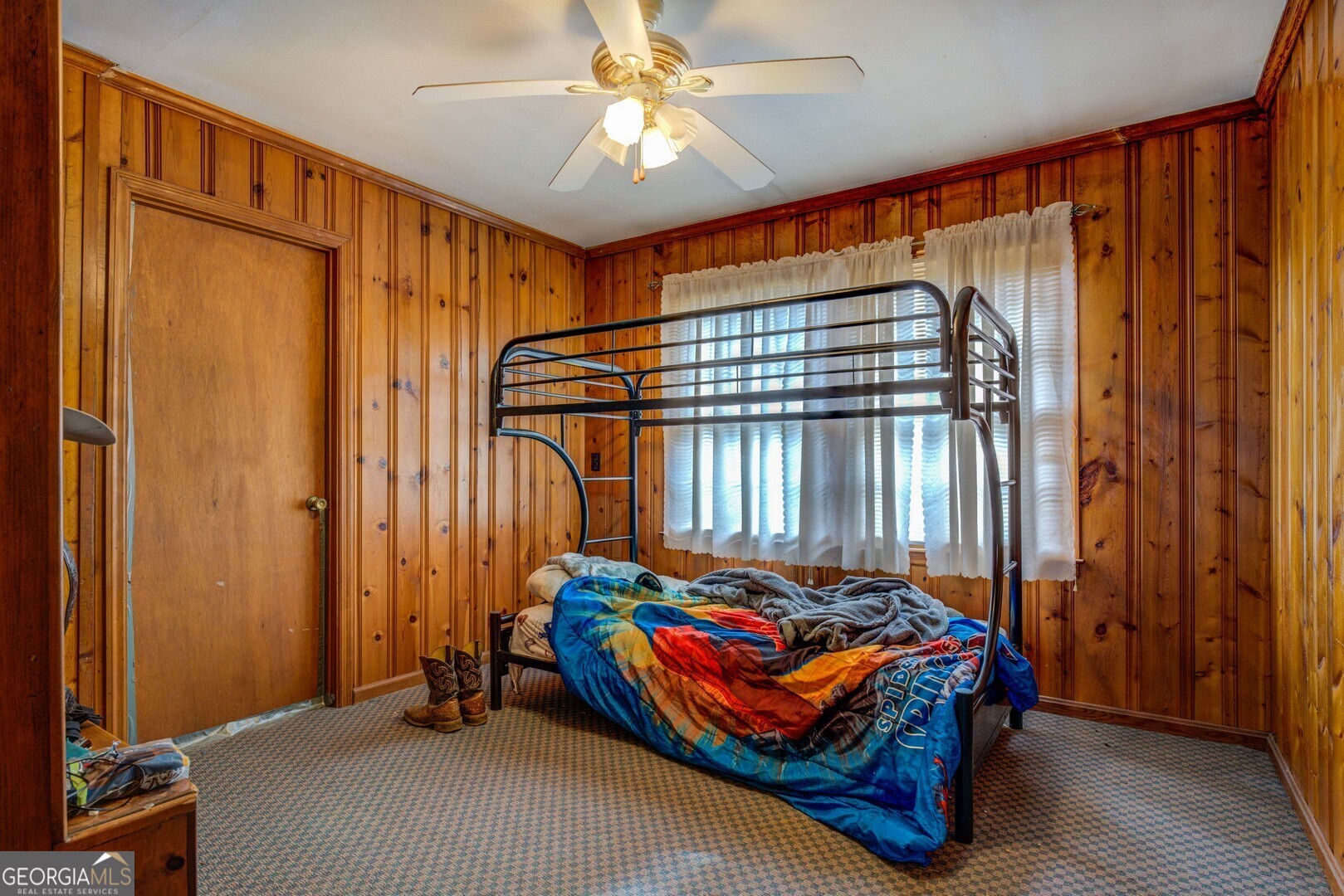 908 Nelson Street Jackson, GA 30233 - Photo 17 of 25 a bedroom with a bed and a window