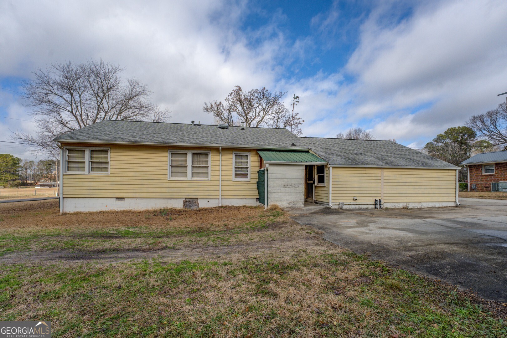 908 Nelson Street Jackson, GA 30233 - Photo 19 of 25 a view of a house with a yard and garage