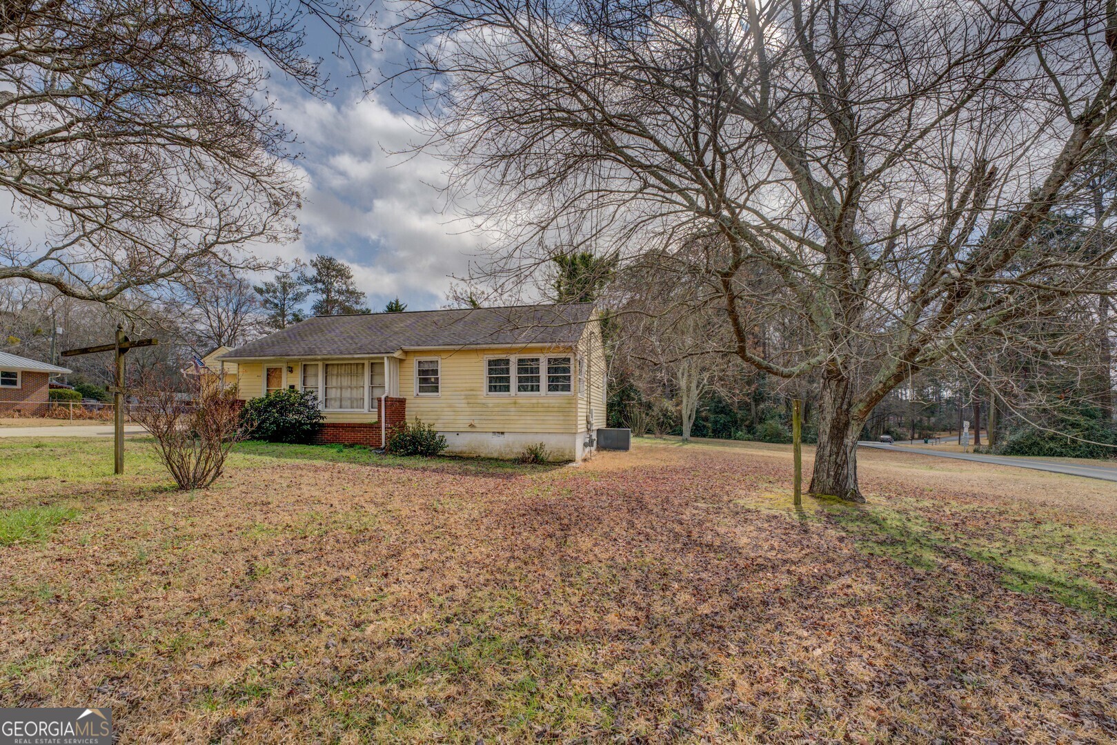 908 Nelson Street Jackson, GA 30233 - Photo 22 of 25 a front view of a house with a yard