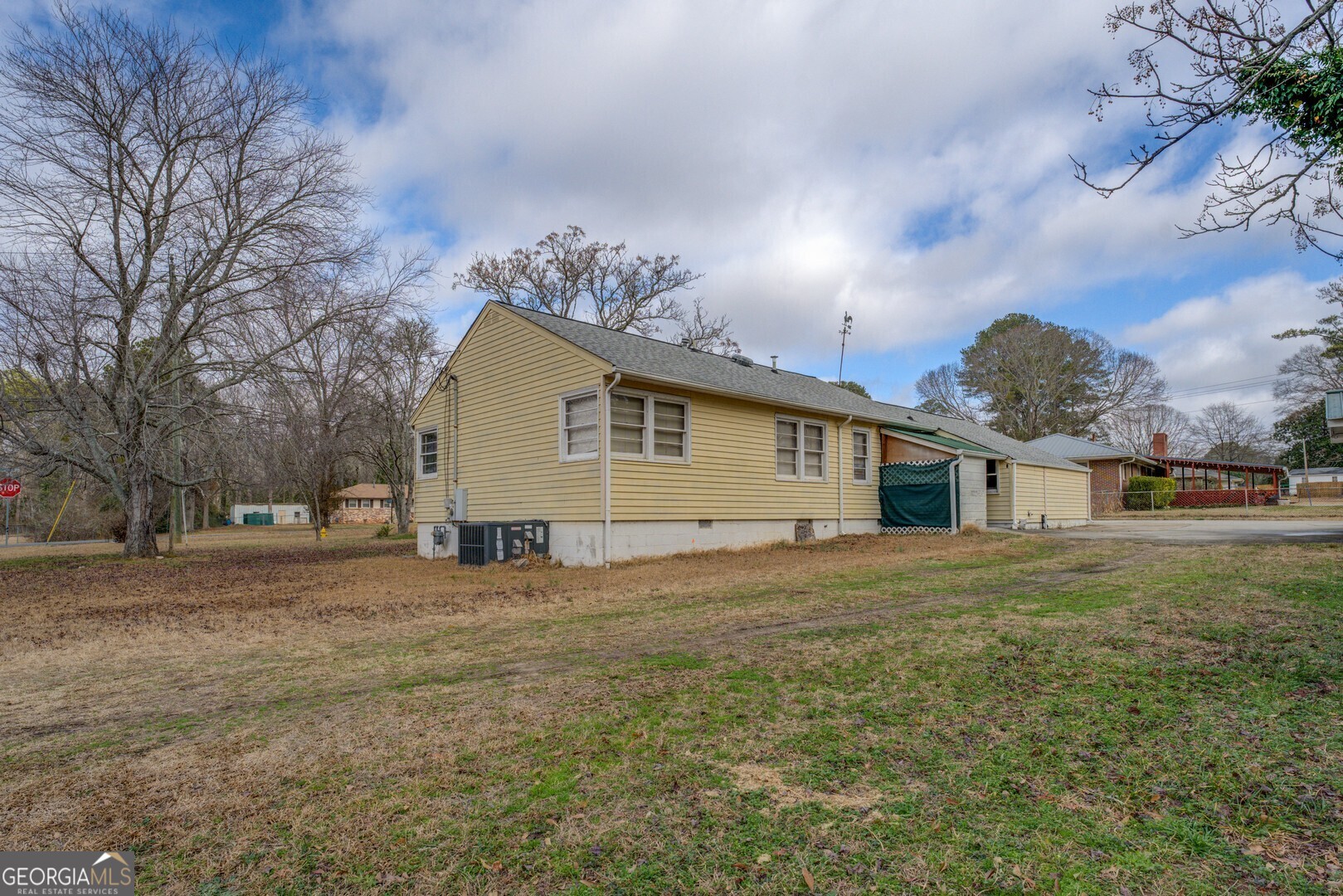 908 Nelson Street Jackson, GA 30233 - Photo 25 of 25 a view of a yard in front of a house with large trees