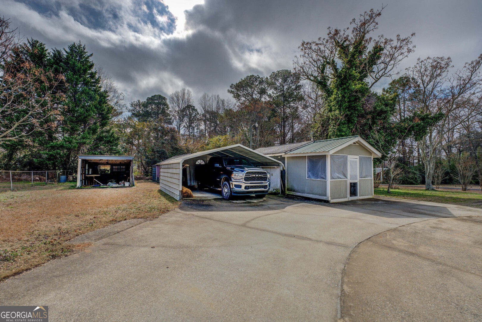 908 Nelson Street Jackson, GA 30233 - Photo 3 of 25 a front view of a house with a yard and garage