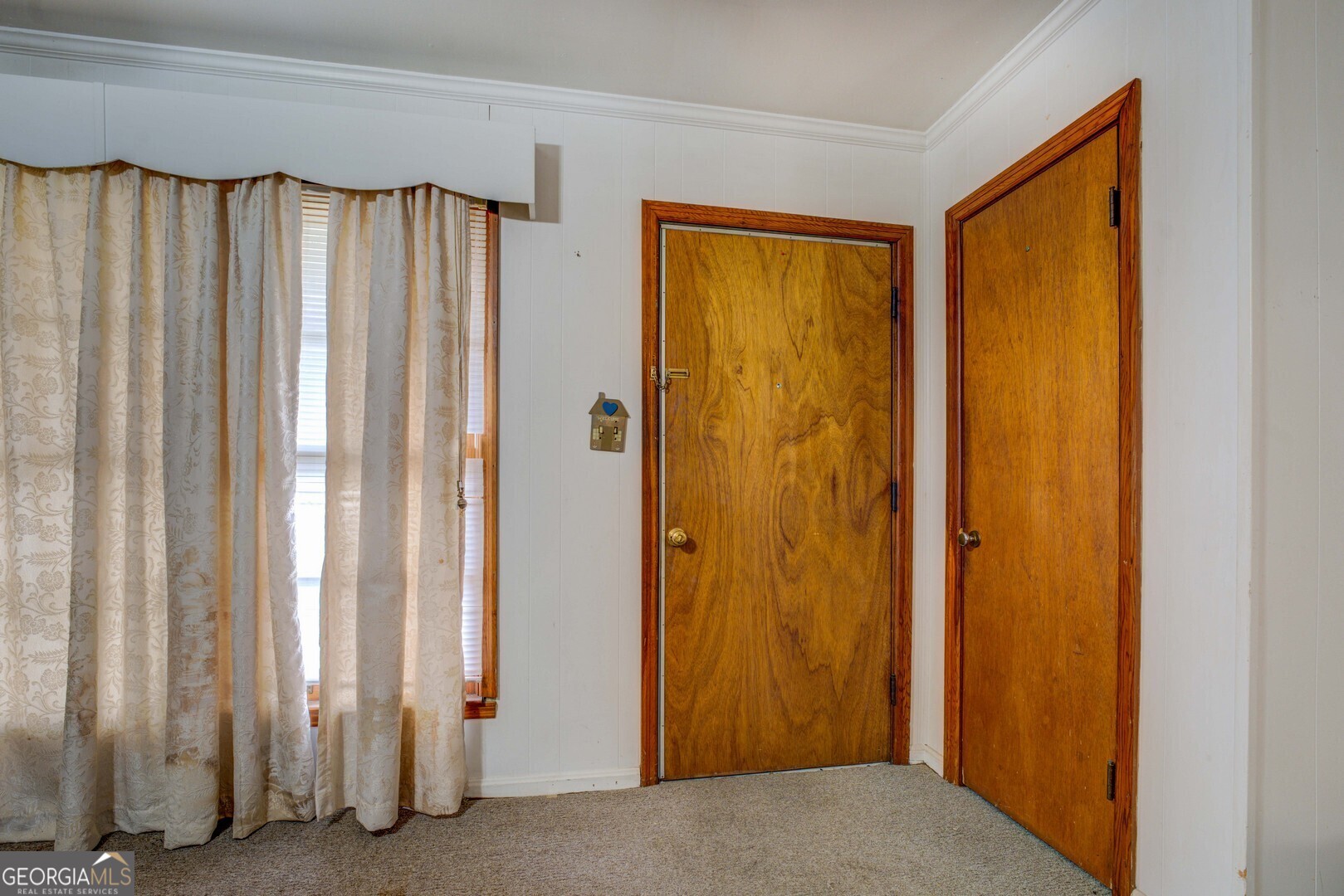 908 Nelson Street Jackson, GA 30233 - Photo 5 of 25 a view of a bathroom with a door