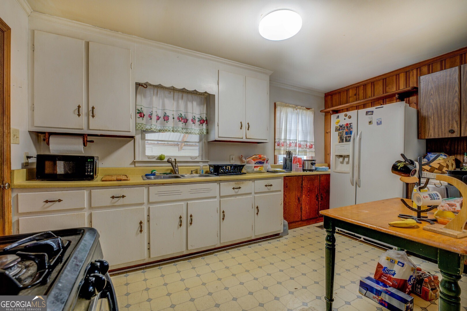 908 Nelson Street Jackson, GA 30233 - Photo 7 of 25 a kitchen with stainless steel appliances a stove a sink and a refrigerator