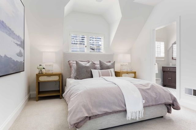 a bedroom with bed and window