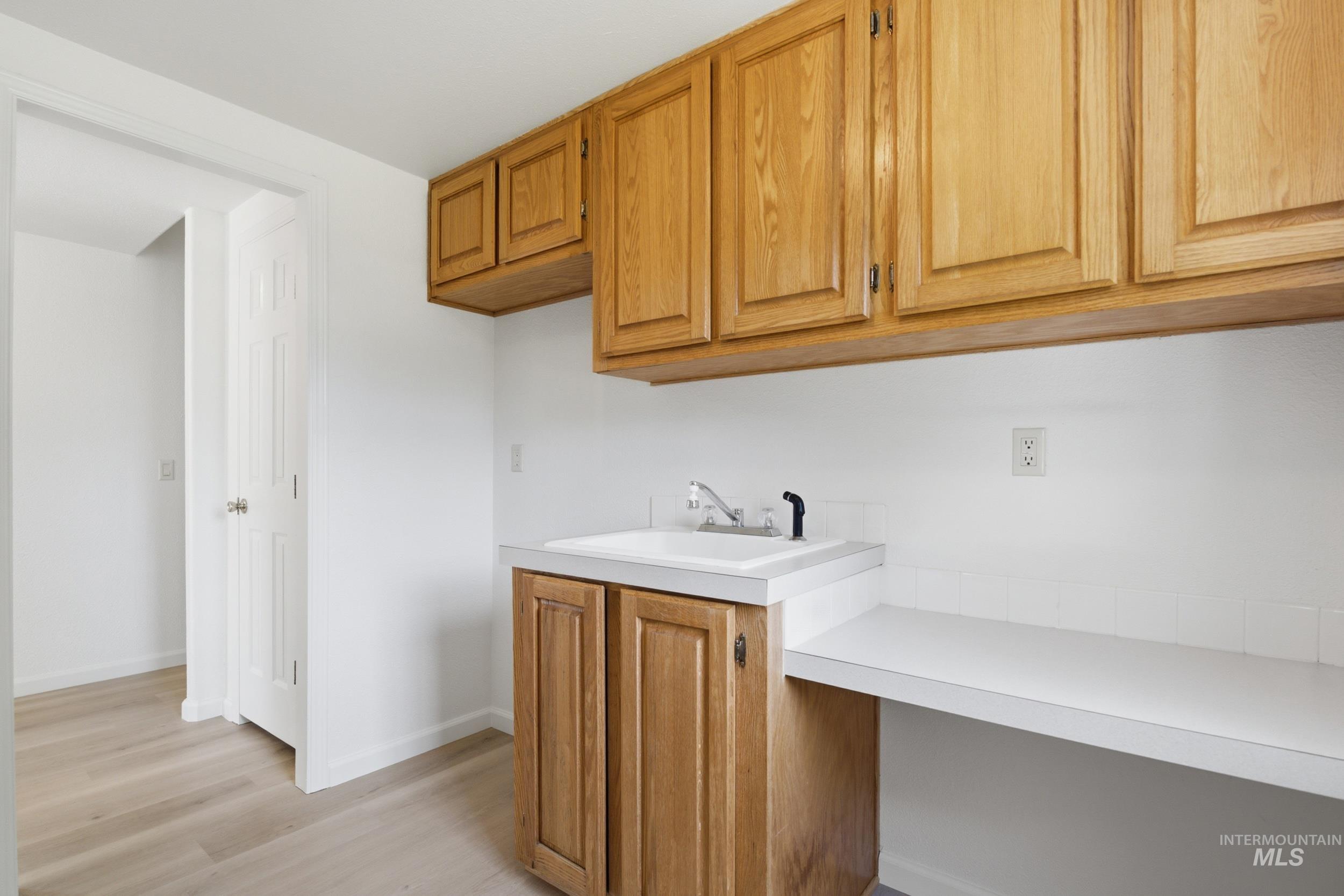 7422 Track Road Nampa, ID 83686 - Photo 18 of 50 Spacious room featuring light-colored textured carpeting, white painted walls, and a large window with white trim