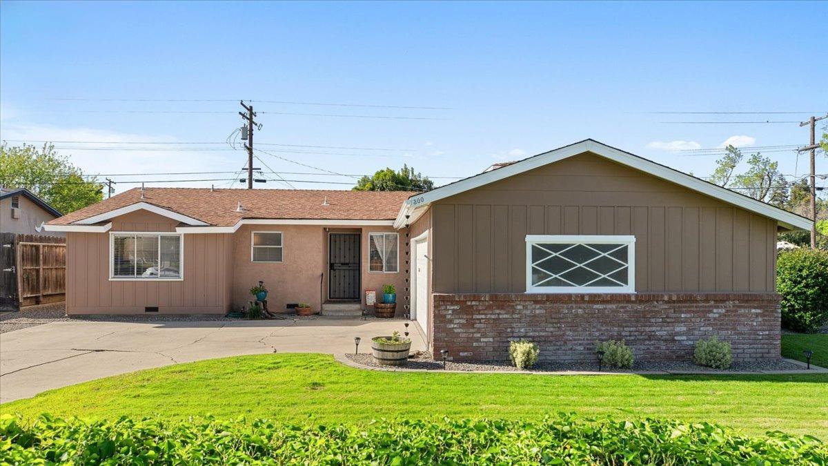 300 Ribier Avenue Modesto, CA 95350 - Photo 1 of 1 a front view of a house with a yard