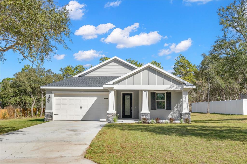 11472 Mandlin Road Weeki Wachee, FL 34614 - Photo 1 of 1 Front elevation of home showing the front covered porch!!!