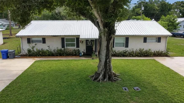 a view of a house with a garden