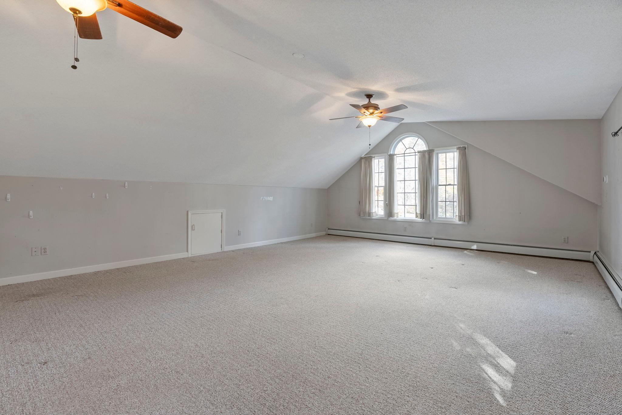 23 Wagon Road Glastonbury, CT 06033 - Photo 20 of 40 an empty room with a window and a ceiling fan