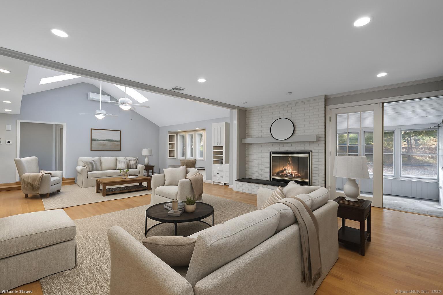 23 Wagon Road Glastonbury, CT 06033 - Photo 2 of 40 a living room with furniture fireplace and a large window