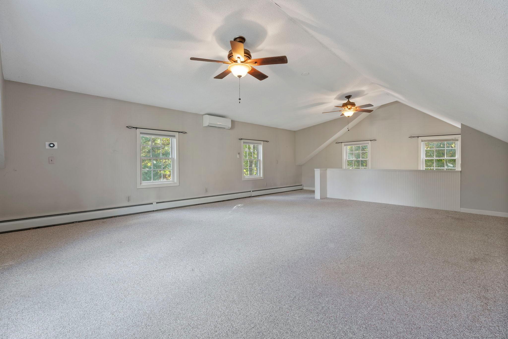 23 Wagon Road Glastonbury, CT 06033 - Photo 21 of 40 a view of a livingroom with a ceiling fan and window