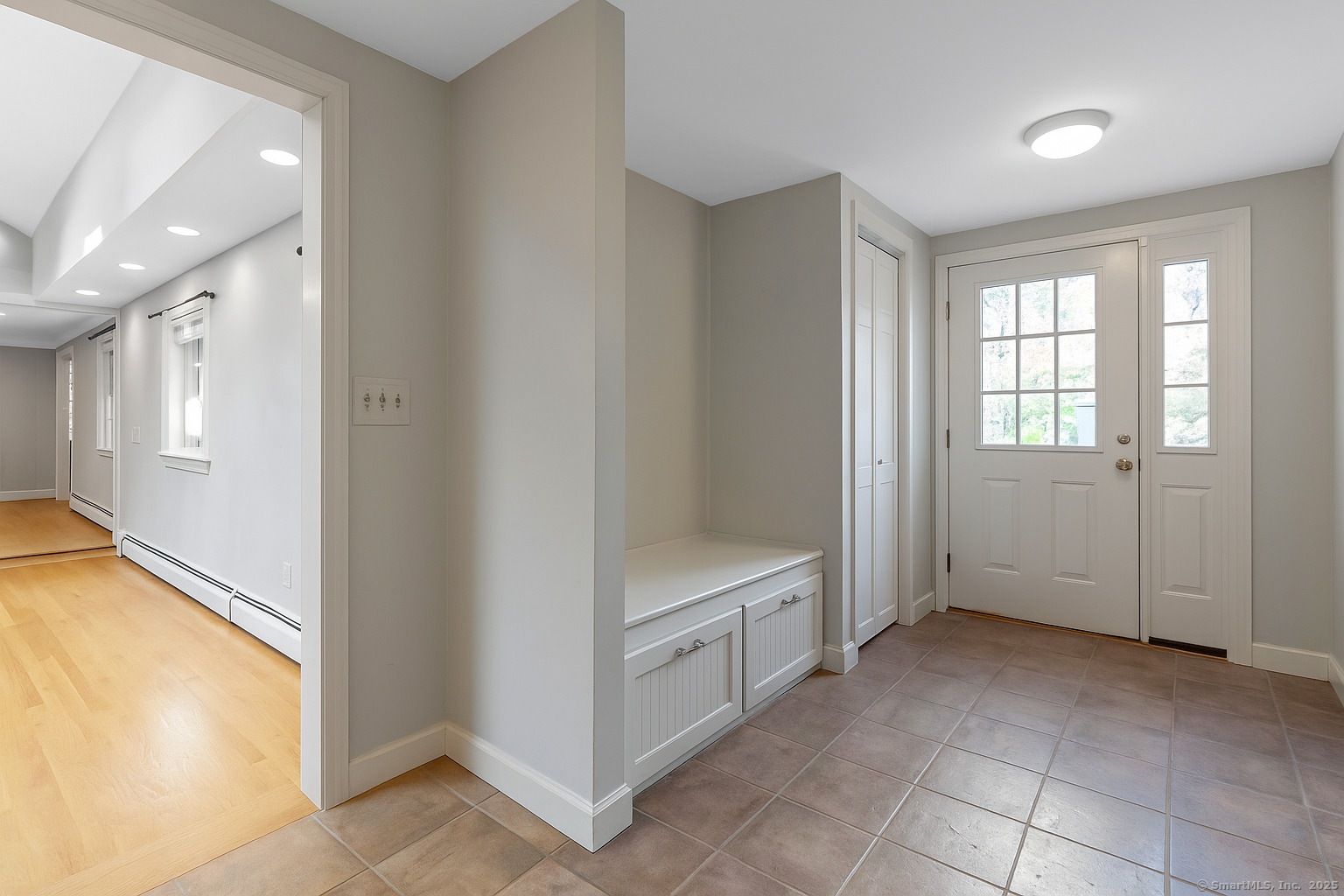 23 Wagon Road Glastonbury, CT 06033 - Photo 22 of 40 a view of a livingroom with an empty space and a window