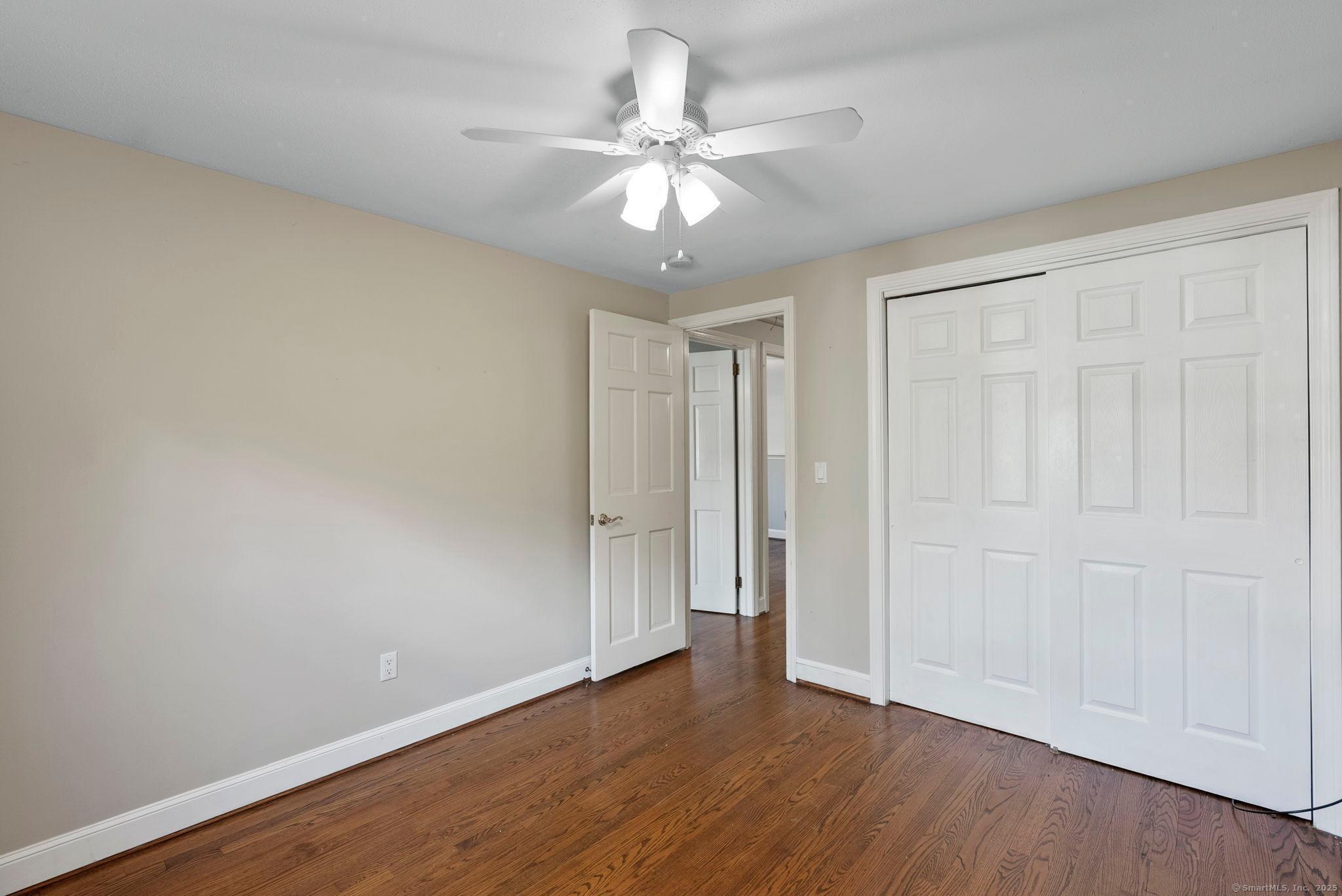 23 Wagon Road Glastonbury, CT 06033 - Photo 25 of 40 a view of an empty room with wooden floor