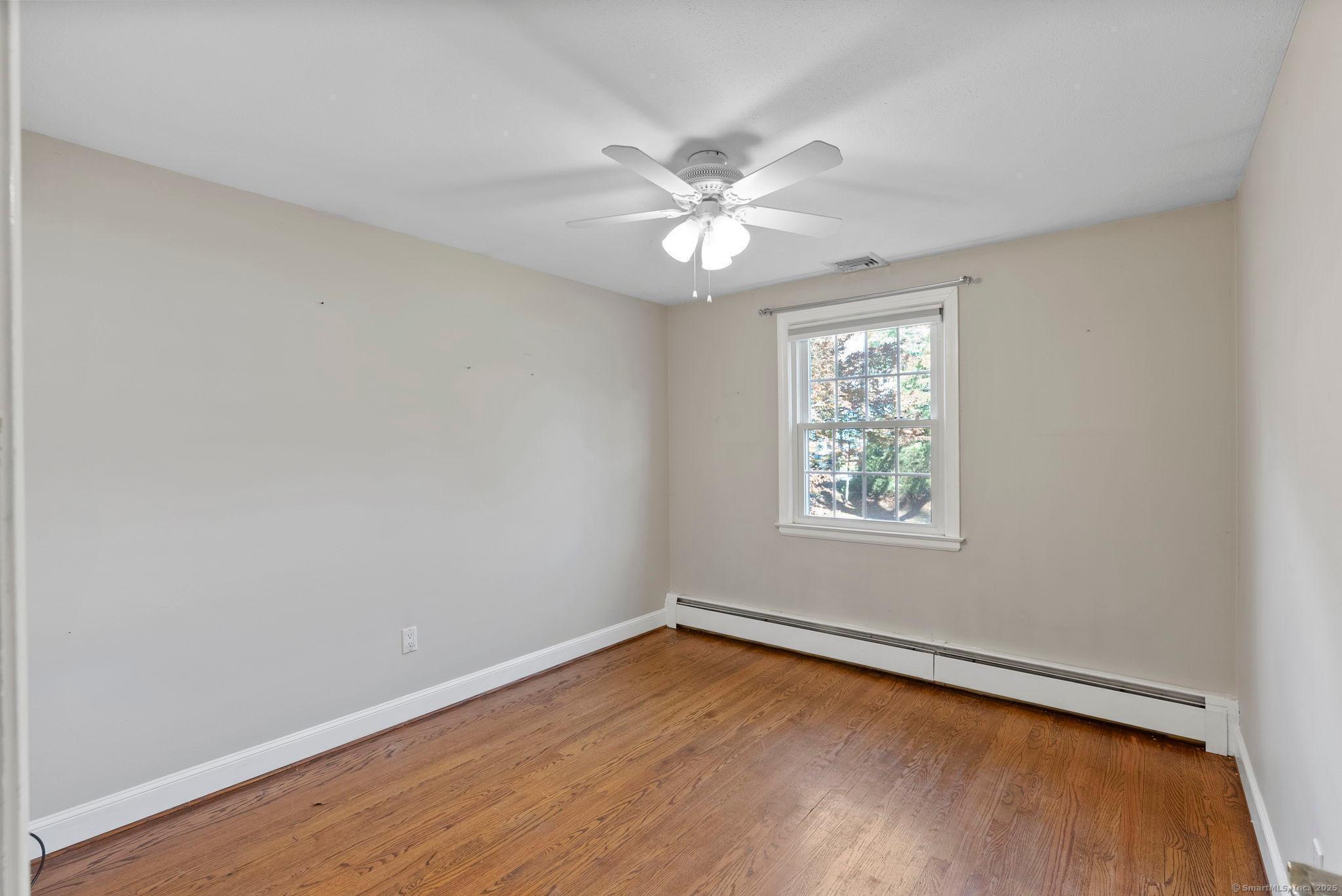23 Wagon Road Glastonbury, CT 06033 - Photo 26 of 40 wooden floor in an empty room with a window