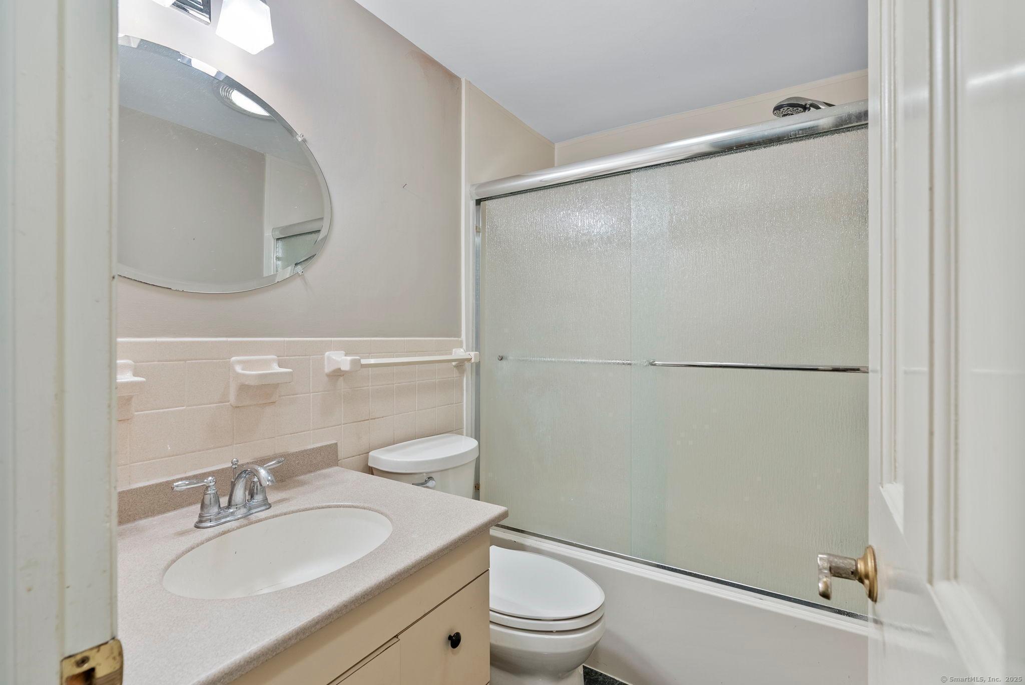 23 Wagon Road Glastonbury, CT 06033 - Photo 29 of 40 a bathroom with a granite countertop sink toilet and shower