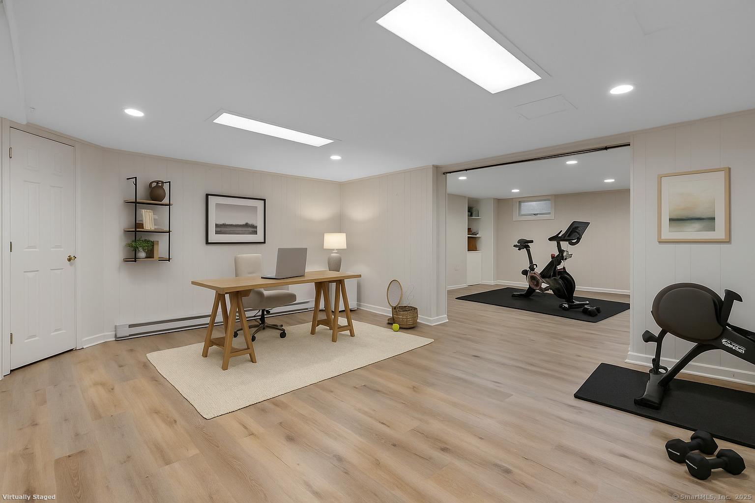 23 Wagon Road Glastonbury, CT 06033 - Photo 32 of 40 a living room with furniture a table and wooden floor
