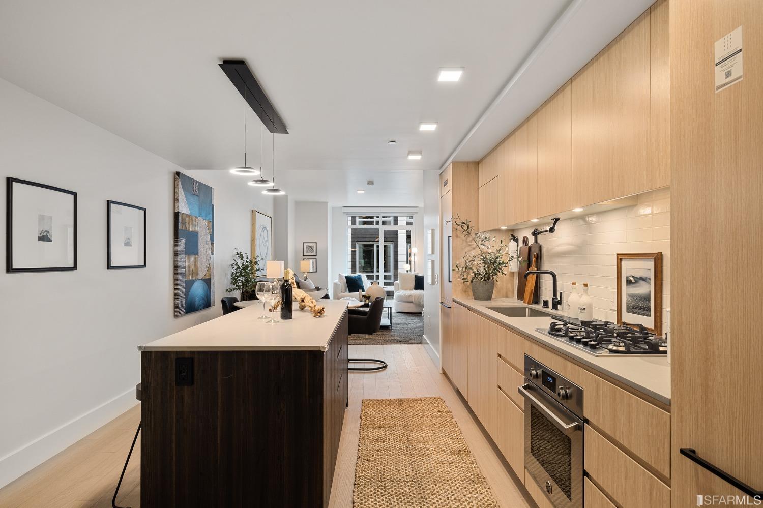 a large kitchen with stainless steel appliances lots of counter space and breakfast area