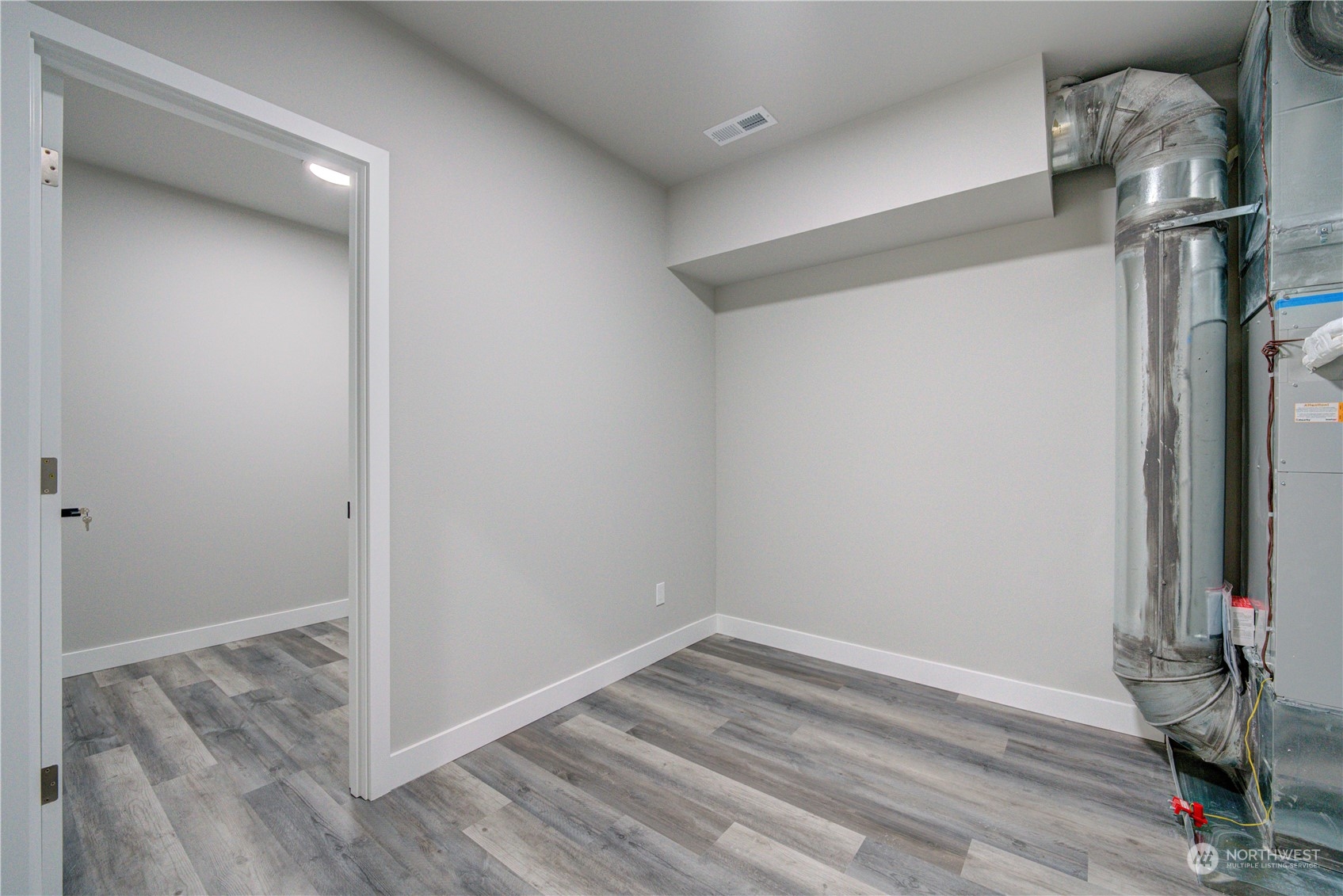 1861 Watkins Road Freeland, WA 98249 - Photo 33 of 39 a view of empty room with wooden floor