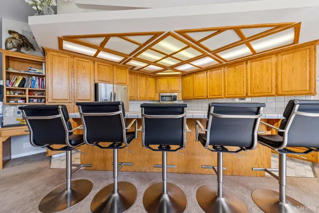 a view of a dining room with furniture window and outside view
