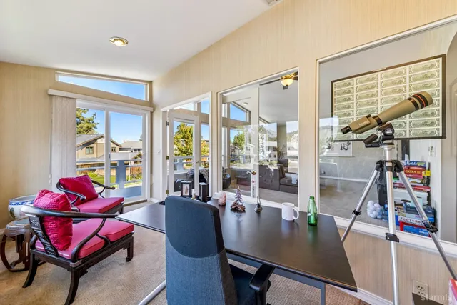 a view of a dining room with furniture window and outside view