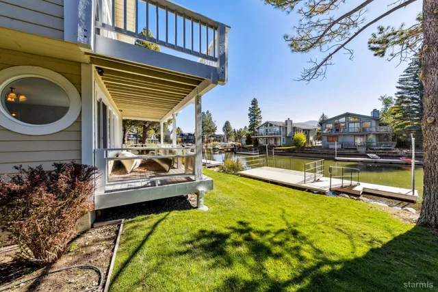 a view of a swimming pool with outdoor seating