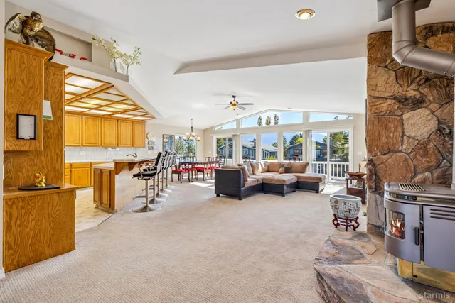 a view of a livingroom with furniture and a window