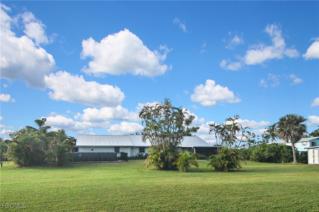 4658 Gulf Shore Road St. James City, FL 33956 - Photo 14 of 50 a view of a lake with a big yard