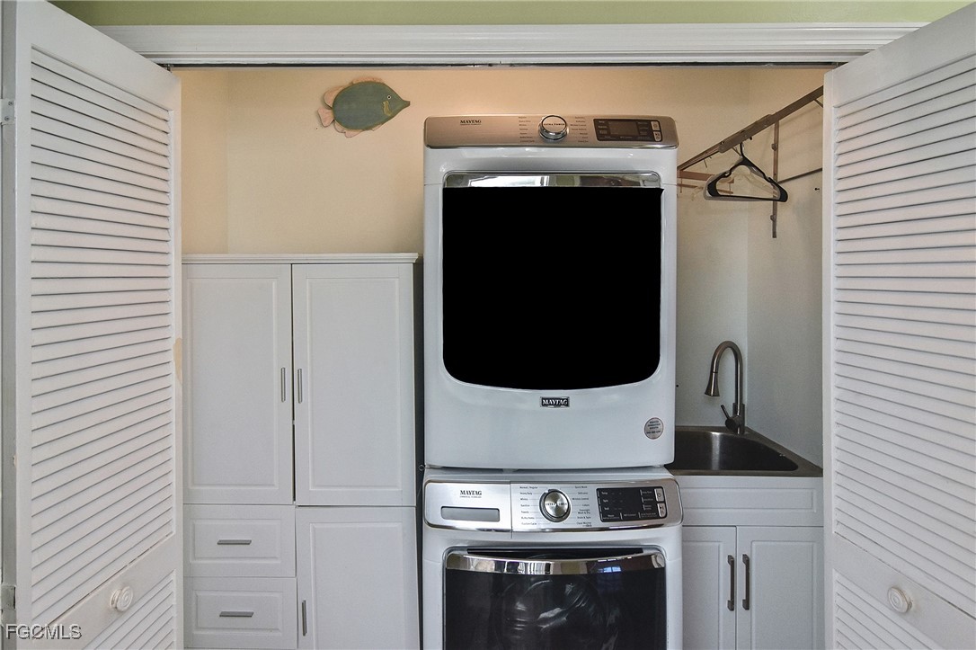 4658 Gulf Shore Road St. James City, FL 33956 - Photo 16 of 50 a utility room with dryer and washer