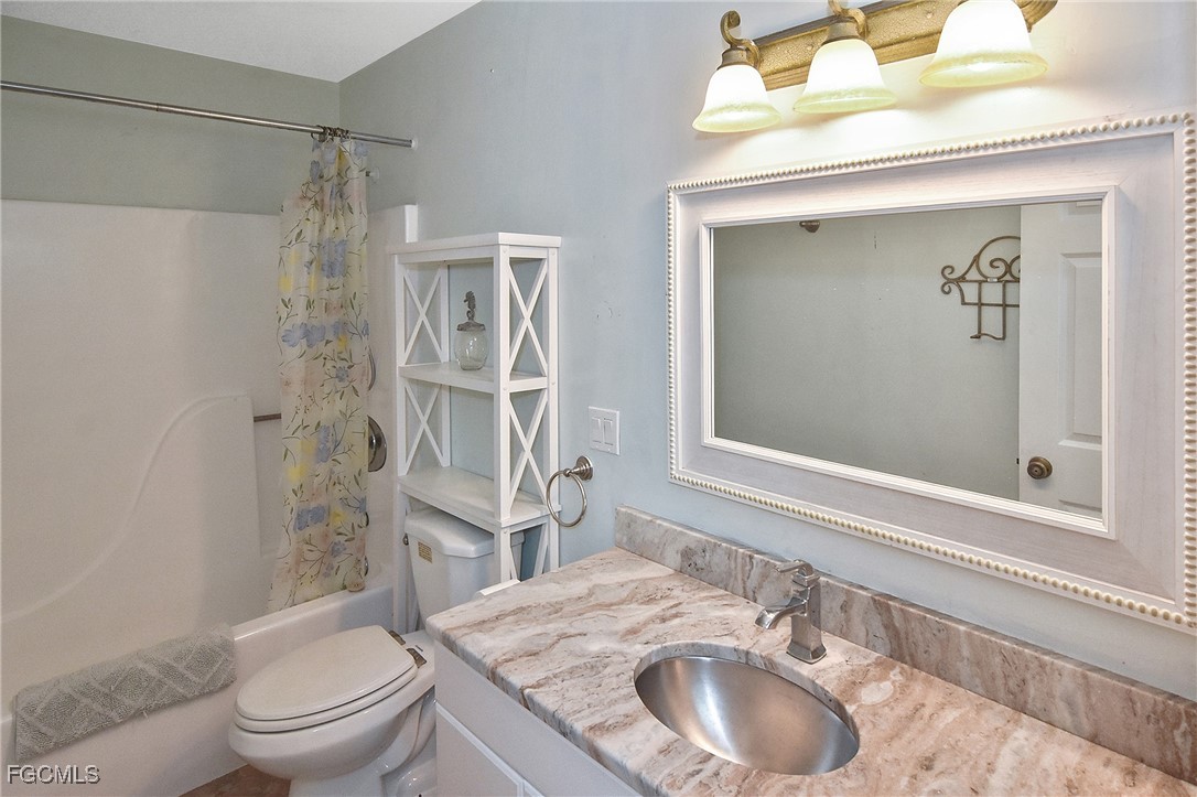 4658 Gulf Shore Road St. James City, FL 33956 - Photo 25 of 50 a bathroom with a sink a toilet and shower