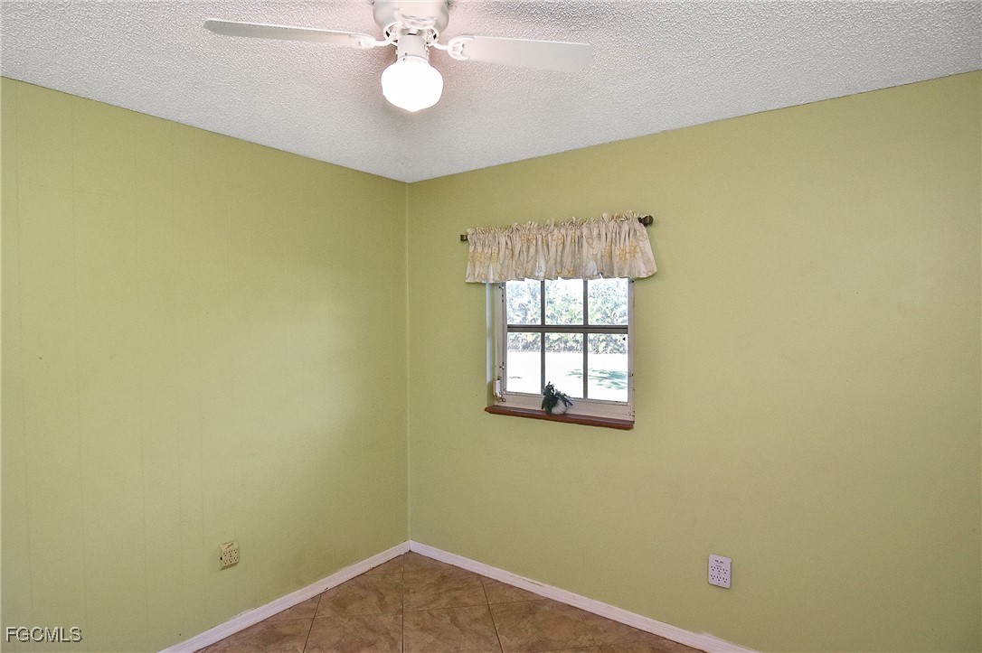 4658 Gulf Shore Road St. James City, FL 33956 - Photo 28 of 50 a view of a room that has a window and wooden floor