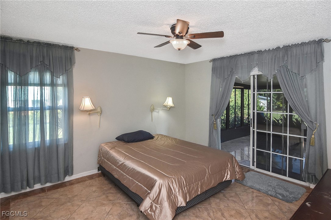 4658 Gulf Shore Road St. James City, FL 33956 - Photo 42 of 50 a bedroom with a bed and a window