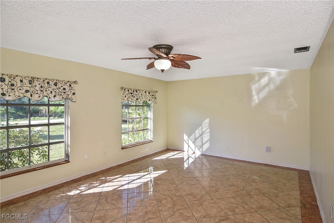 4658 Gulf Shore Road St. James City, FL 33956 - Photo 44 of 50 a view of wooden floor in an empty room with a window