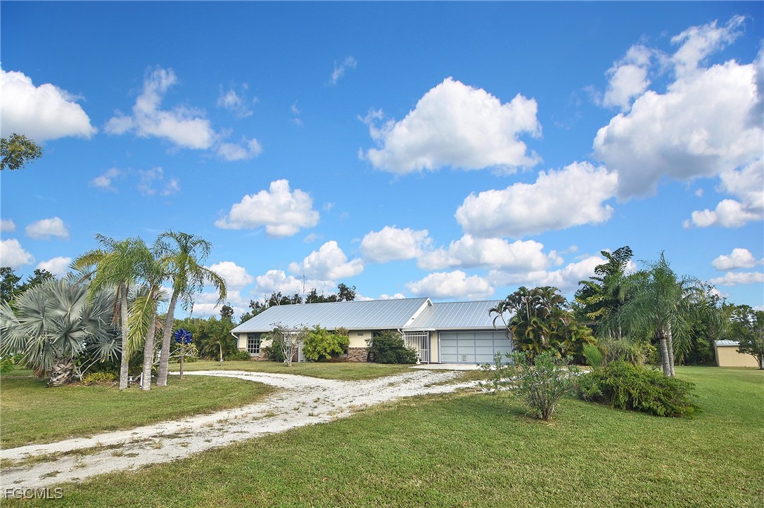 4658 Gulf Shore Road St. James City, FL 33956 - Photo 10 of 50 a view of a house with a big yard